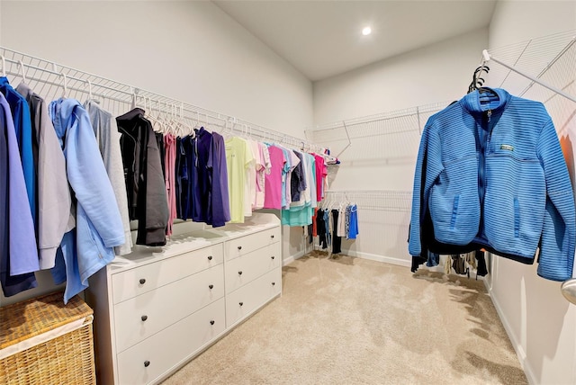 spacious closet featuring light carpet