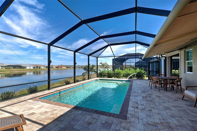 view of pool with a lanai, a patio area, and a water view