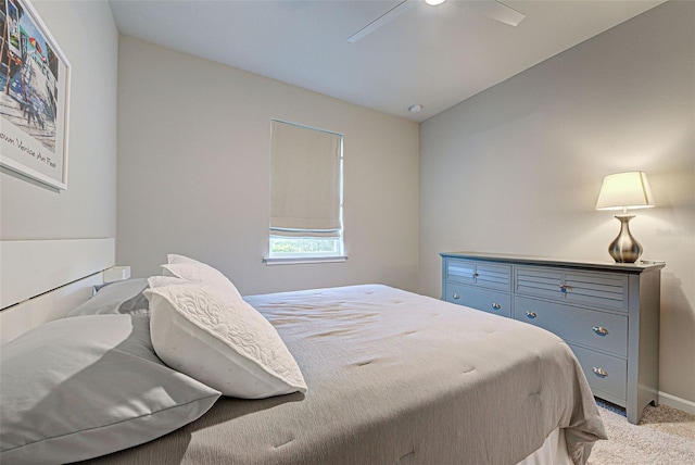 carpeted bedroom with lofted ceiling and ceiling fan