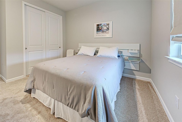 carpeted bedroom featuring a closet