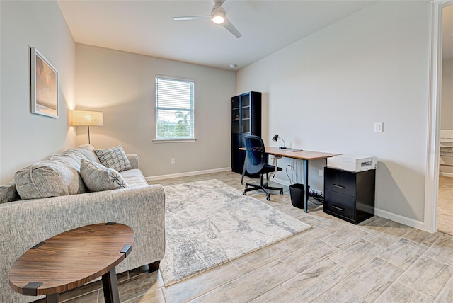 office featuring wood-type flooring and ceiling fan