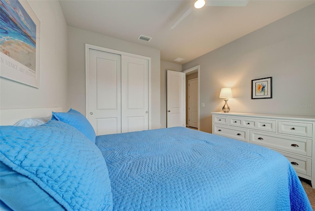 bedroom with ceiling fan and a closet