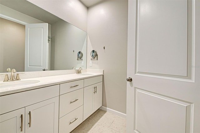 bathroom with tile patterned flooring and vanity