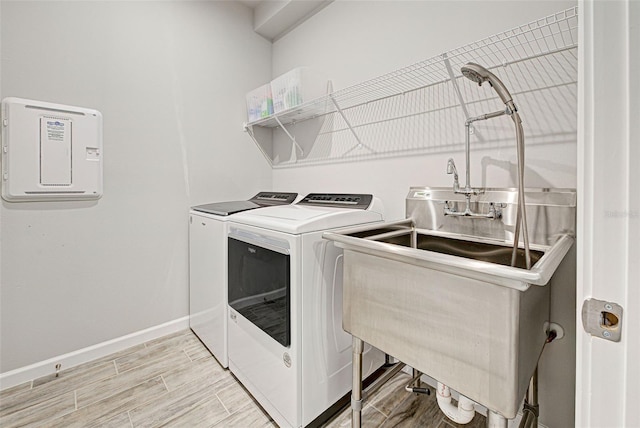 washroom featuring sink and washer and dryer