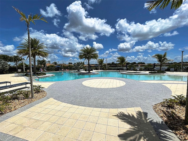 view of swimming pool with a patio area