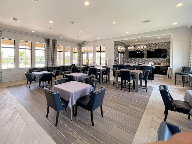 dining room featuring crown molding