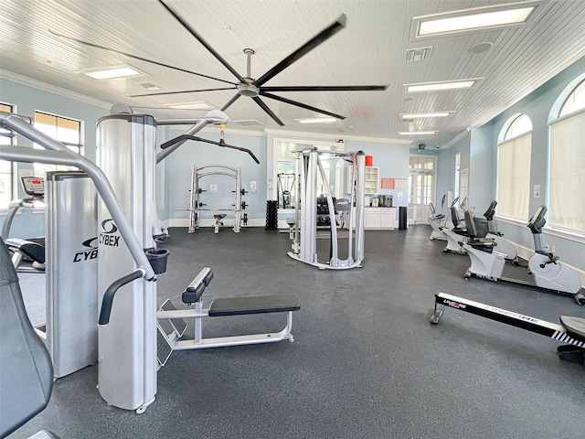 gym with crown molding and ceiling fan