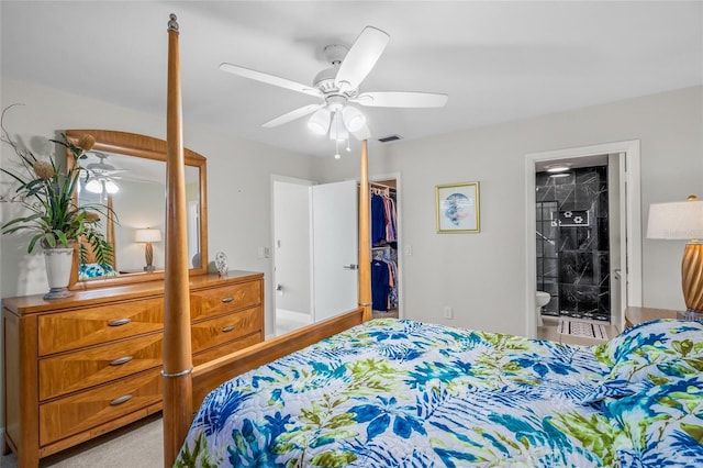 bedroom featuring a walk in closet, connected bathroom, ceiling fan, and a closet