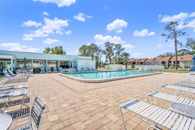 view of swimming pool with a patio area