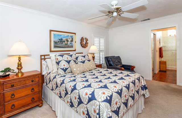 bedroom featuring light carpet, ensuite bath, ornamental molding, and ceiling fan