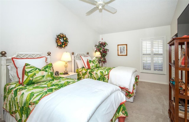 bedroom featuring lofted ceiling, light carpet, and ceiling fan