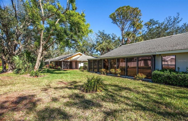 view of yard with a sunroom