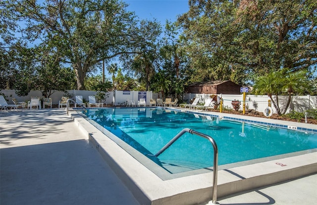 view of swimming pool featuring a patio area