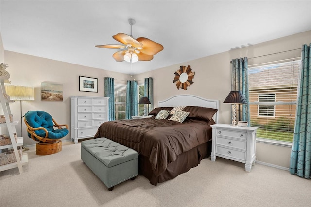 bedroom featuring light carpet and ceiling fan