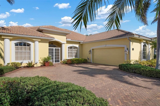 mediterranean / spanish-style home featuring a garage