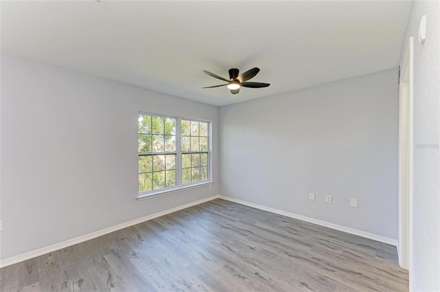 spare room with ceiling fan and light hardwood / wood-style floors