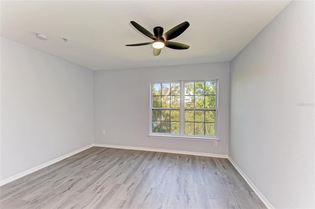 unfurnished room featuring ceiling fan and light hardwood / wood-style flooring