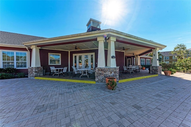 rear view of property featuring a patio and ceiling fan