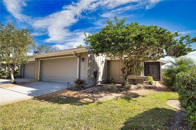 view of front of home with a garage and a front yard