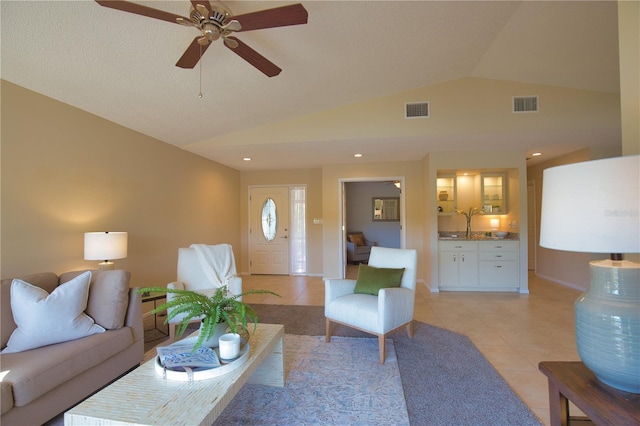 tiled living room with lofted ceiling