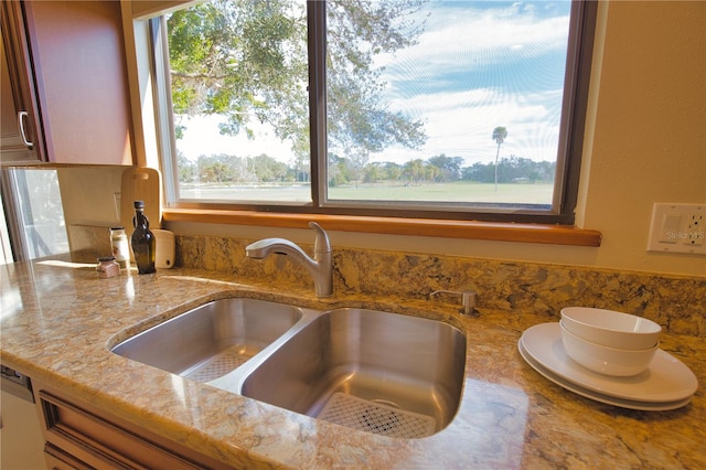 details featuring sink and light stone countertops