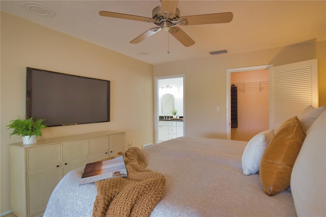 bedroom with sink and ceiling fan