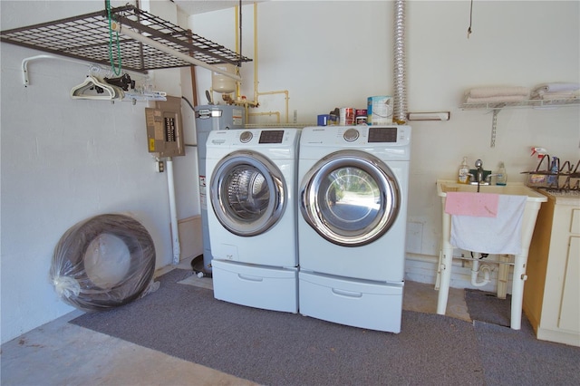 laundry area featuring independent washer and dryer and sink