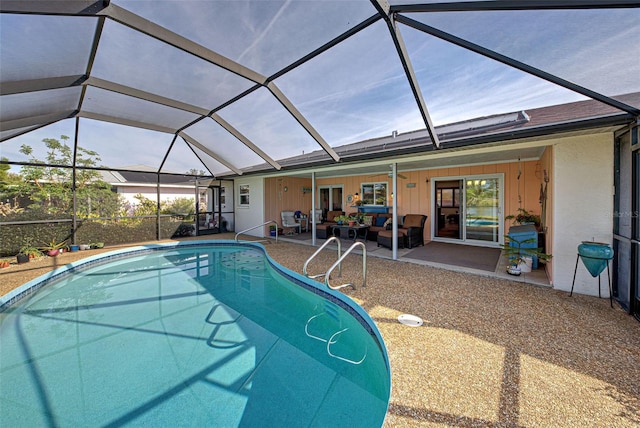 view of pool featuring an outdoor living space, a lanai, and a patio area