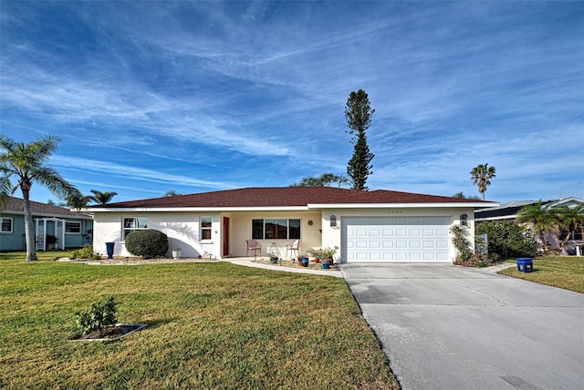 ranch-style house featuring a garage and a front yard