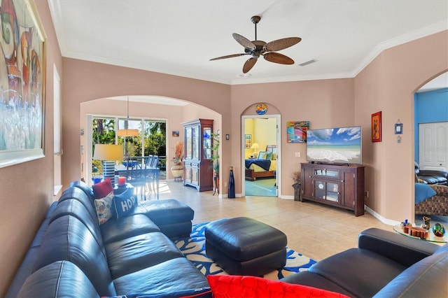 living room with ornamental molding, light tile patterned flooring, and ceiling fan