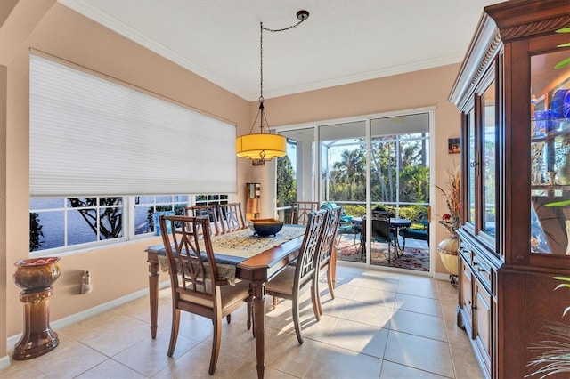 tiled dining room with ornamental molding