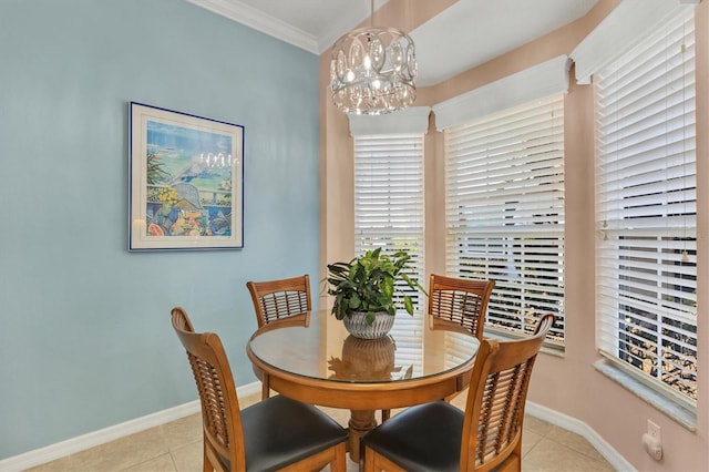 dining area featuring ornamental molding, light tile patterned floors, and an inviting chandelier