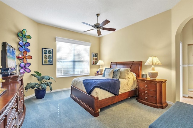 bedroom featuring light colored carpet and ceiling fan