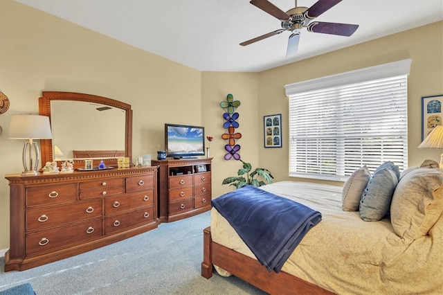 bedroom featuring light carpet and ceiling fan