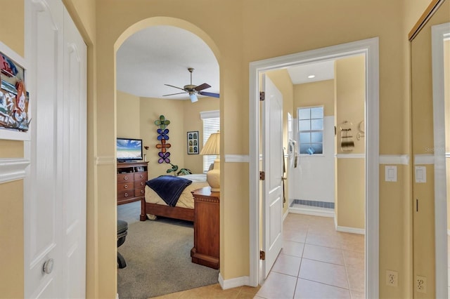 hallway featuring light tile patterned flooring