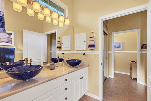 bathroom featuring tile patterned flooring and vanity