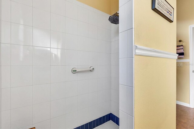 bathroom with tiled shower