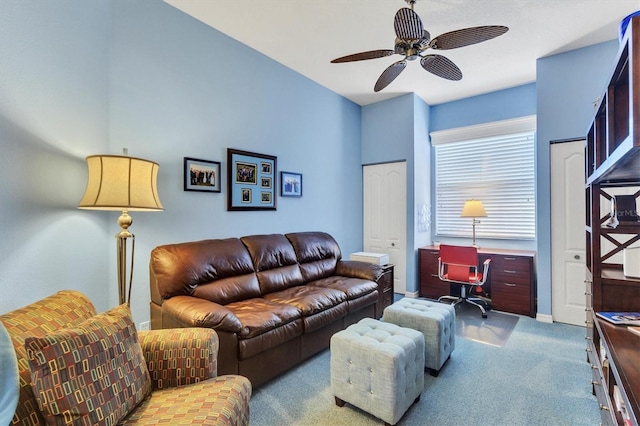 living room featuring ceiling fan and light carpet