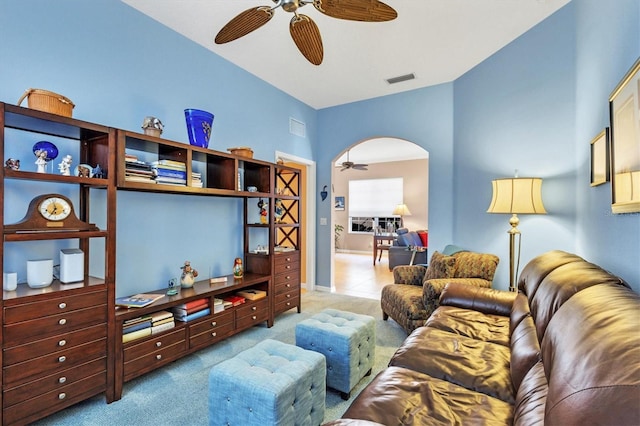 carpeted living room featuring ceiling fan