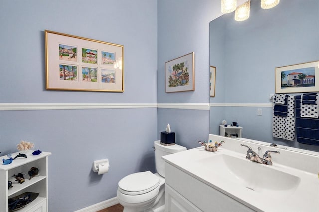 bathroom with vanity and toilet