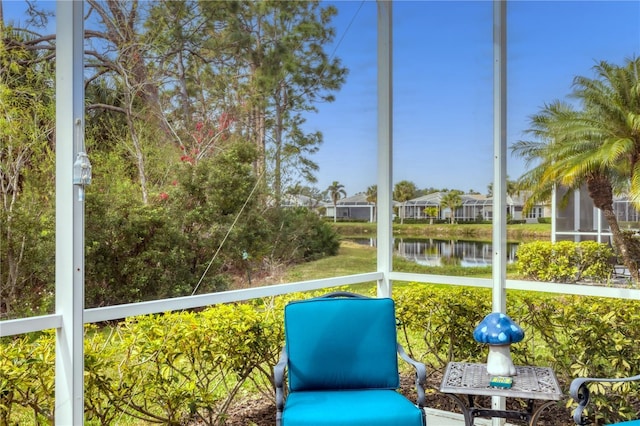 unfurnished sunroom with a water view