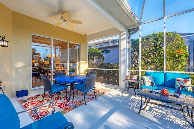 sunroom featuring ceiling fan