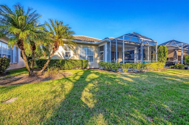 view of front of home with a lanai and a front yard