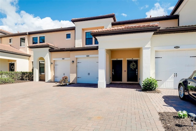 view of front of property featuring french doors and a garage