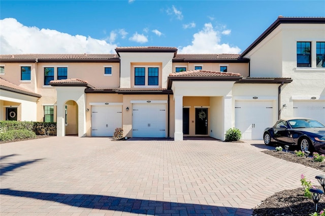 mediterranean / spanish-style house featuring a garage