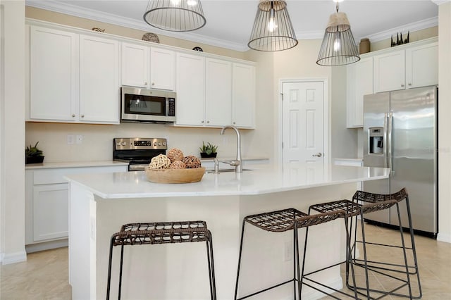 kitchen with white cabinetry, sink, a center island with sink, and appliances with stainless steel finishes