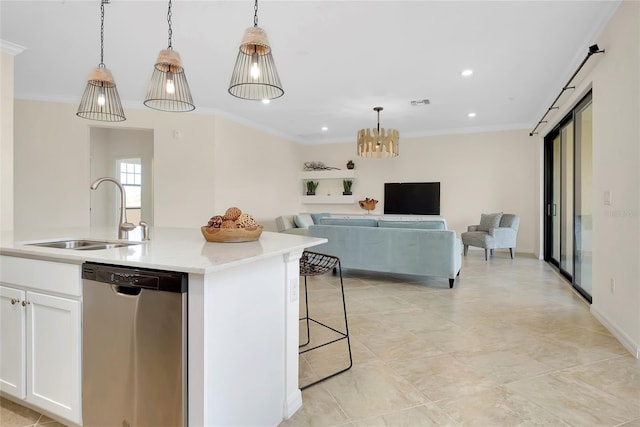 kitchen featuring sink, decorative light fixtures, dishwasher, an island with sink, and white cabinets