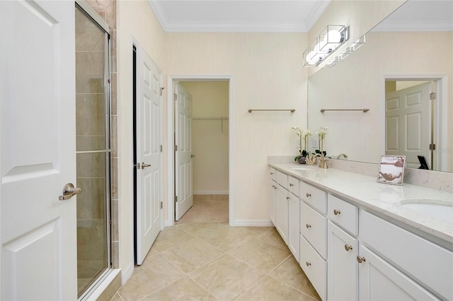 bathroom featuring vanity, tile patterned flooring, crown molding, and walk in shower