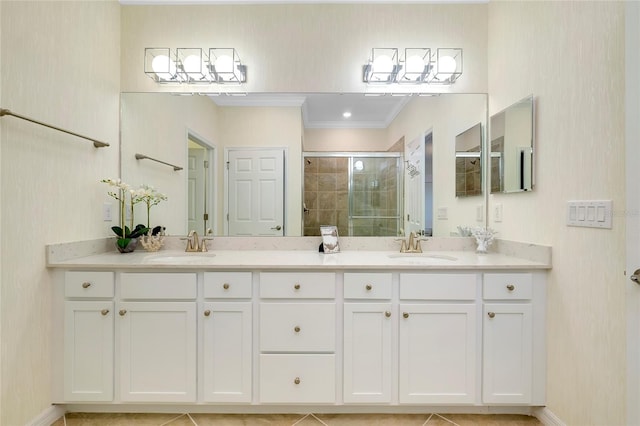 bathroom featuring crown molding, vanity, and a shower with door