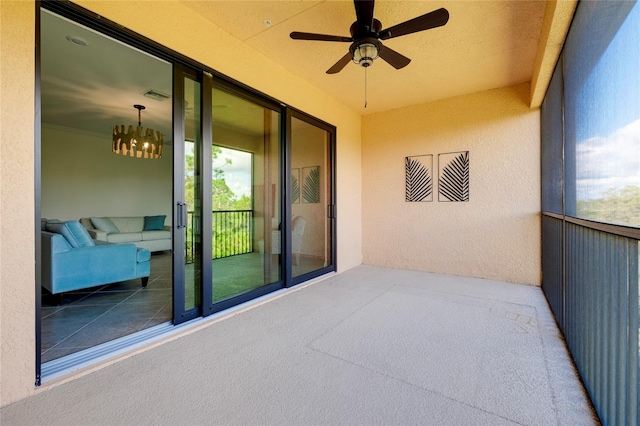 exterior space with ceiling fan and a balcony